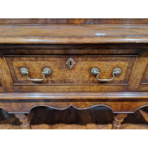 1156 - Reproduction inlaid oak dresser, the plate rack with scalloped frieze, the base banded with three fr... 