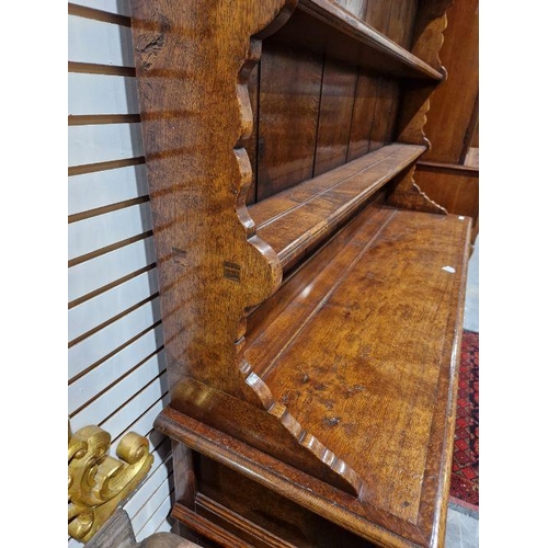 1156 - Reproduction inlaid oak dresser, the plate rack with scalloped frieze, the base banded with three fr... 