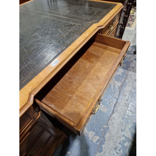 1183 - Modern walnut veneer partners' desk with green leather inset top, having one long drawer flanked by ... 