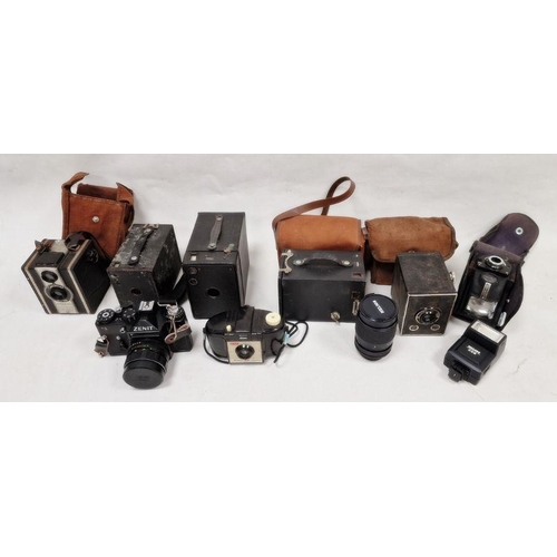 132 - Vintage cameras to include a Kodak Brownie 127, a Zenit 11 camera etc., a Helios lens and Helios fla... 