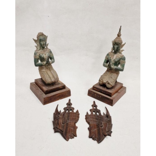 147 - Two 20th century Buddhist figures depicting a male and female kneeling in prayer, both raised on two... 