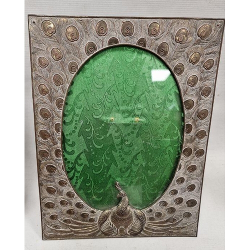 151 - Assorted collectables to include an ornate embossed metal photograph frame depicting a peacock, a ca... 