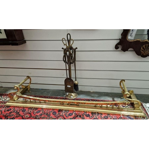 156 - Brass fire curb with raised support to the front and twin handles, 134cm long approx. and a set of f... 