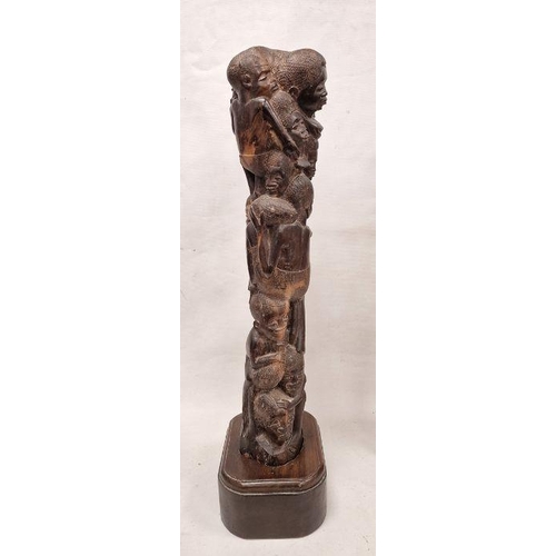 167 - Two African tribal carvings, one of a man and the other of group of figures, the largest 73cm high a... 