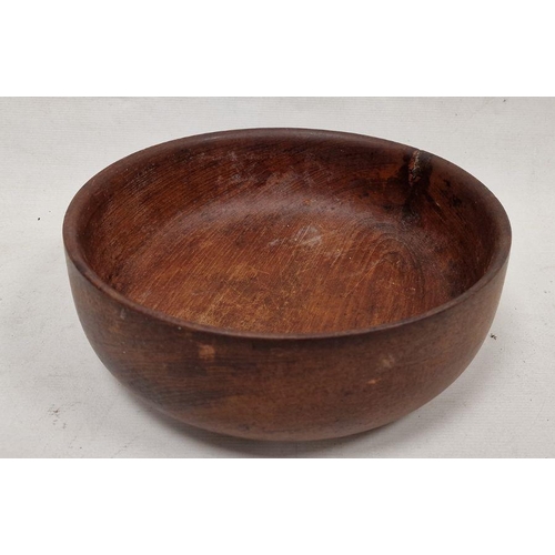 169 - Carved wooden fruitbowl of circular form, 30cm diameter approx.