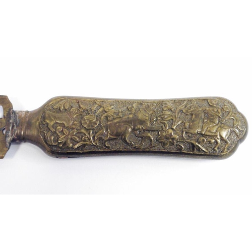 183 - Early 20th century Anglo-Indian metal page turner/letter opener, the handle embossed with birds and ... 