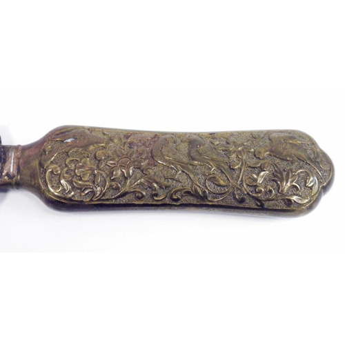 183 - Early 20th century Anglo-Indian metal page turner/letter opener, the handle embossed with birds and ... 