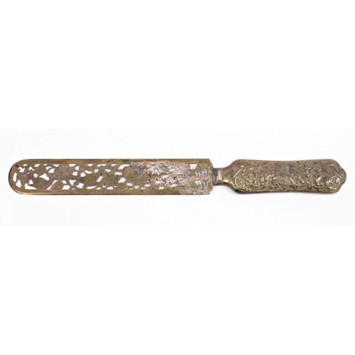 183 - Early 20th century Anglo-Indian metal page turner/letter opener, the handle embossed with birds and ... 