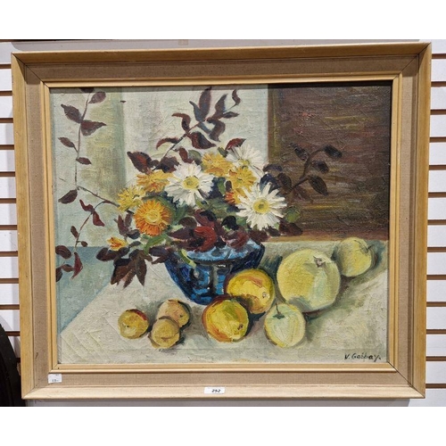 252 - V Gabbay 
 Oil on canvas
 Still life vase of flowers with fruit, signed lower right