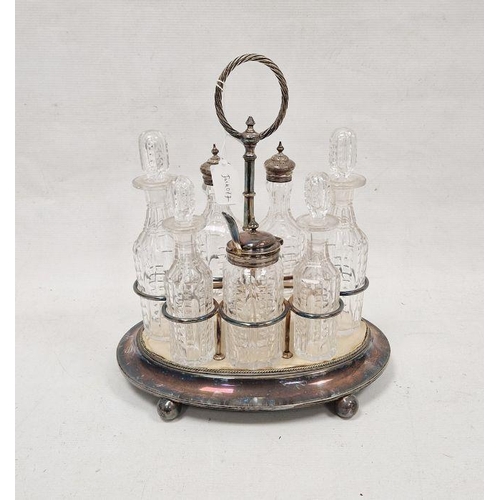 284B - 19th century silver plated condiment set on original fitted stand, comprising four cut glass bottles... 