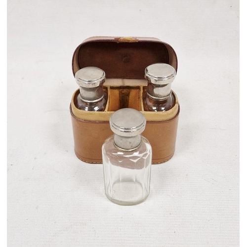 286 - Leather cased silver-plated lidded three-glass bottle set, initialled to case R.G.