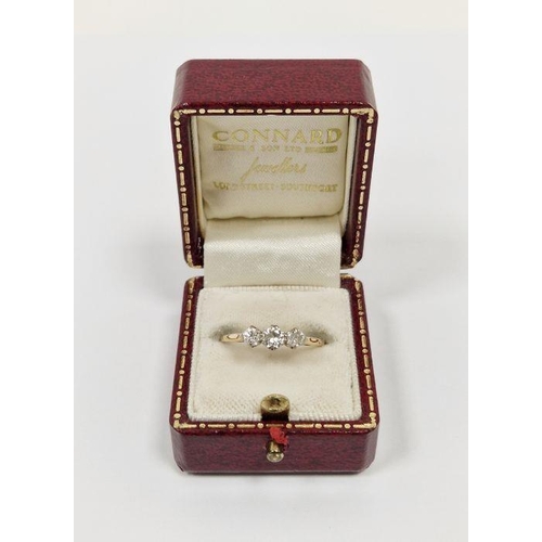 450 - Gold and diamond three-stone ring (band worn), in Connard & Sons fitted box, 1.7g