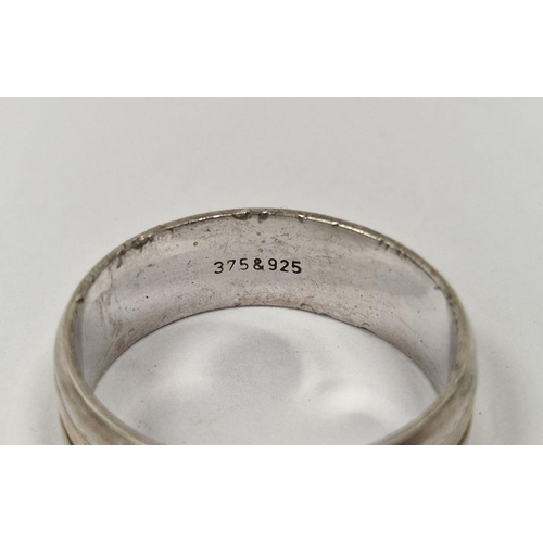 491 - 9ct gold and silver banded ring, line engraved, marked to the inside 375 and 925, 5.5g total