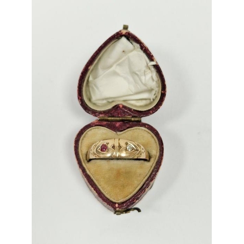 498 - Gold-coloured metal, ruby and diamond dress ring with two worn stones in heart-shaped box