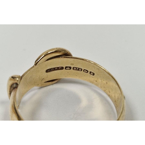 551 - 9ct gold buckle ring, 3.9g and an 18ct gold ring, marked 750, 2.9g (2)