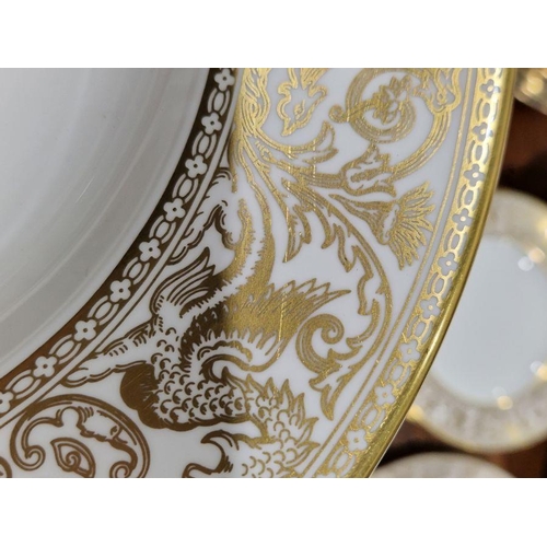 57 - Wedgwood 'Gold Florentine' pattern bone china part dinner service printed with gilt borders of griff... 