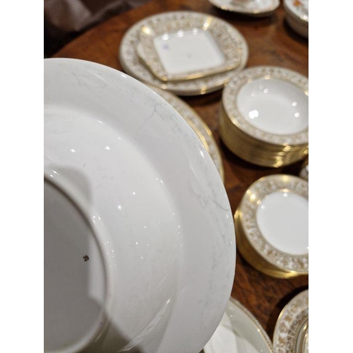 57 - Wedgwood 'Gold Florentine' pattern bone china part dinner service printed with gilt borders of griff... 