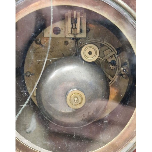 1008 - Late 19th century French red marble cased mantel clock, the gilt framed circular dial having gilt en... 