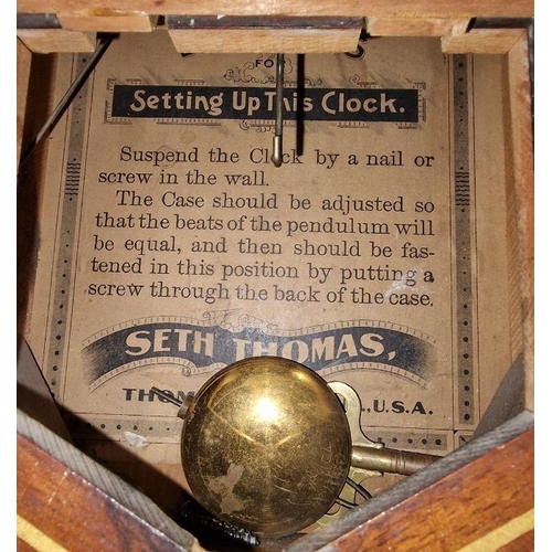 1018 - Early 20th century American wall clock by Seth Thomas retailed by F Norville of Gloucester, the circ... 