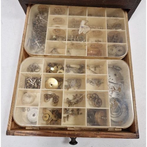 1036 - 20th century stained wooden storage cabinet containing a quantity of assorted pocket watch movements... 