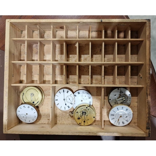 1036 - 20th century stained wooden storage cabinet containing a quantity of assorted pocket watch movements... 