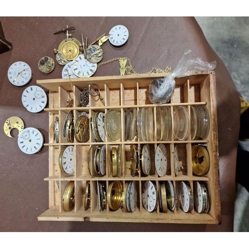 1036 - 20th century stained wooden storage cabinet containing a quantity of assorted pocket watch movements... 