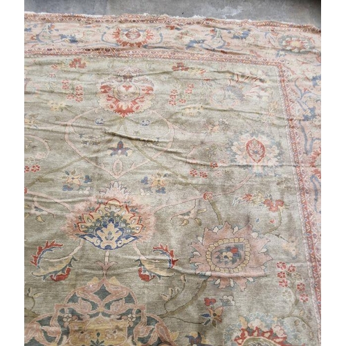 1049 - Very large pale green ground Turkish wool rug with central floral medallion on floral interlocked fi... 