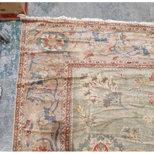 1049 - Very large pale green ground Turkish wool rug with central floral medallion on floral interlocked fi... 