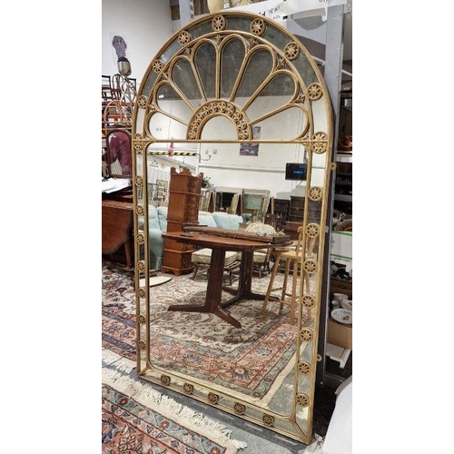 1245 - Large gilt framed mirror with arched top decorated with circular pierced and carved gilt floral moti... 