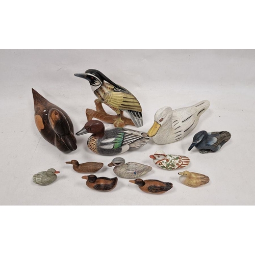 192 - Assortment of carved wooden ducks and other birds, including decoys, some having painted decoration,... 