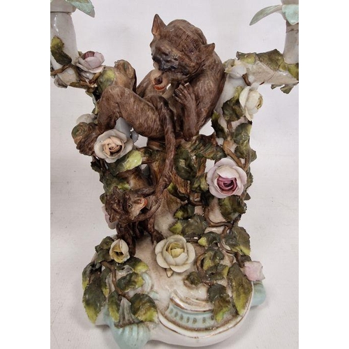 48 - Pair German Plaue porcelain monkey candelabra, each two-branched and floral encrusted with monkeys t... 