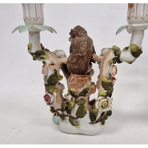 48 - Pair German Plaue porcelain monkey candelabra, each two-branched and floral encrusted with monkeys t... 