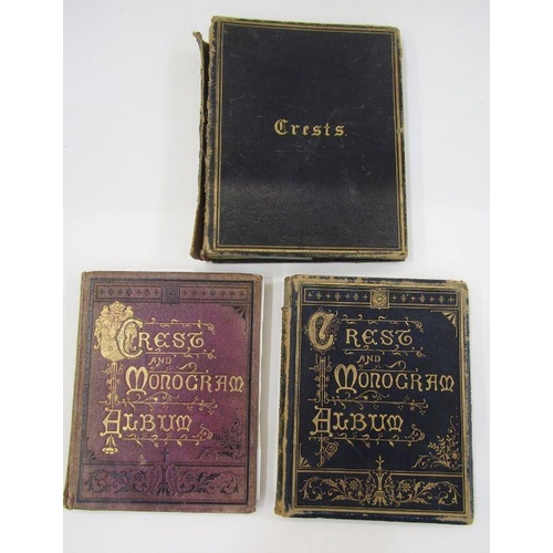 116 - Crests and monograms - three albums variously printed and with hand colouring and having applied mil... 