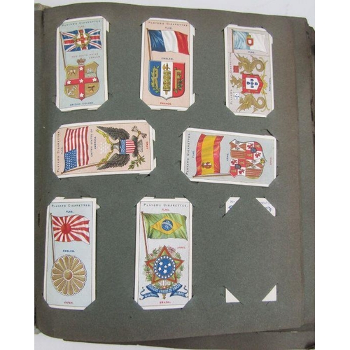 136 - Old Roland Hill stamp album, with a few World stamps, GB, Europe etc  and two albums of cigarette ca... 