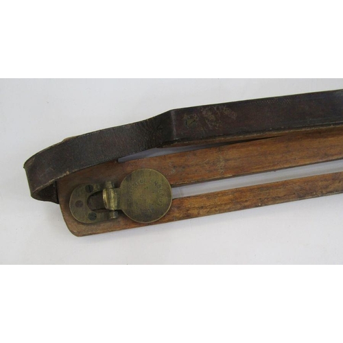 149 - Bussey patent game carrier, the pierced elm frame with hinged brass clips and leather strap and a Sp... 