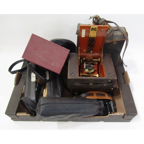 162 - Bell & Howell 200 EE movie camera in brown leather carrying case, an Eastman Kodak folding bellows c... 