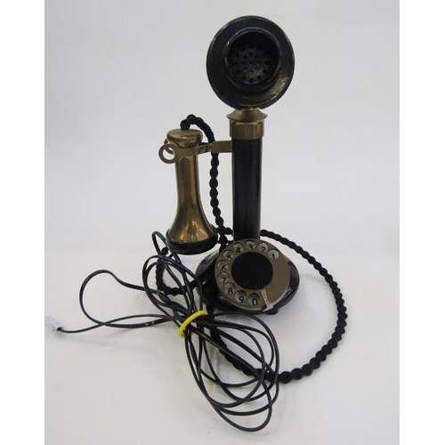 169 - Early 20th century bakelite and brass candlestick telephone with the accompanying bell ringing set, ... 