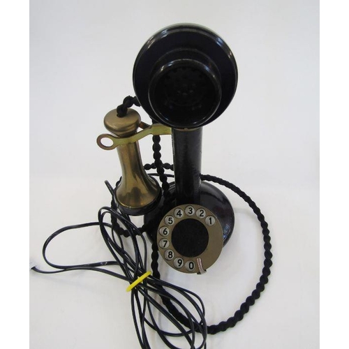 169 - Early 20th century bakelite and brass candlestick telephone with the accompanying bell ringing set, ... 