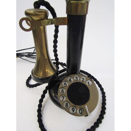 169 - Early 20th century bakelite and brass candlestick telephone with the accompanying bell ringing set, ... 