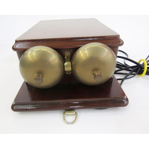 169 - Early 20th century bakelite and brass candlestick telephone with the accompanying bell ringing set, ... 