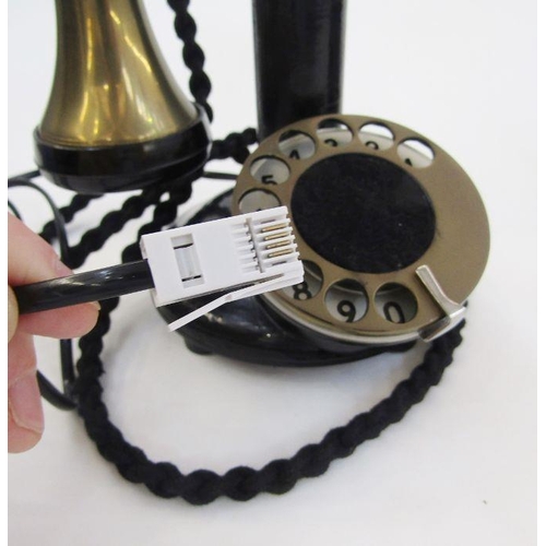 169 - Early 20th century bakelite and brass candlestick telephone with the accompanying bell ringing set, ... 