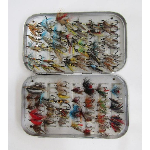 175 - Three metal cases of salmon and fly fishing flies.