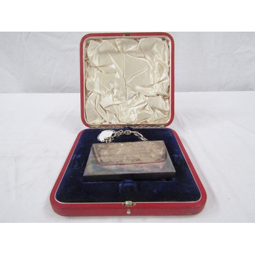 203 - Silver plated section of armour plate from HMS Ocean, dated 1897, cased.