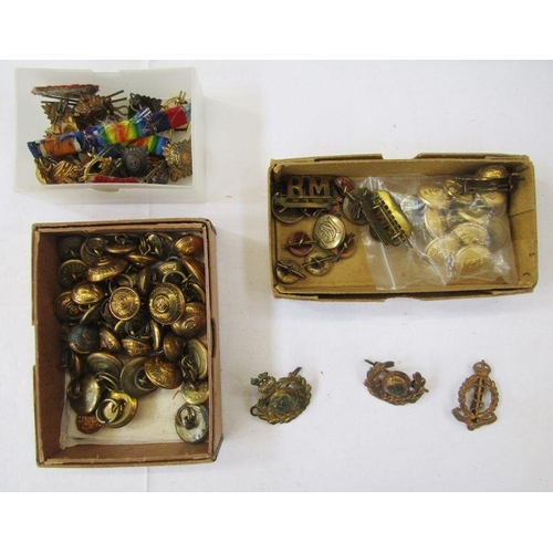 204 - Collection of military cap badges and buttons, together with an Omega watch box.