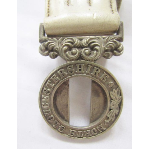 208 - Victorian white metal North Gloucestershire regiment belt buckle and belt.