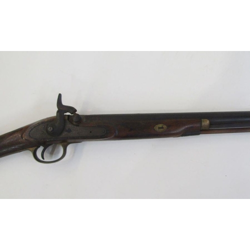 212 - A 19th century percussion rifle with walnut and brass stock, complete with ram-rod.