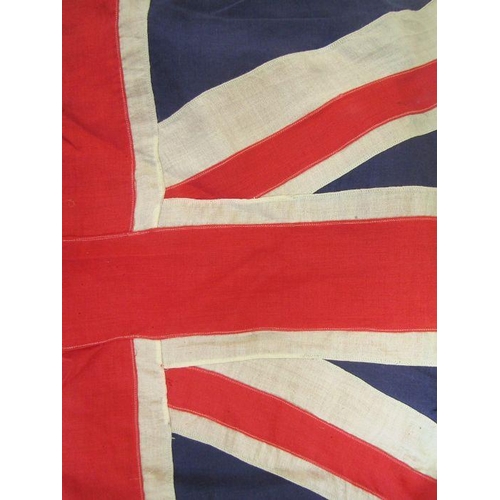 224 - Two red ensign (240 x 120cm and 300 x 150cm approx), two Cross of St. George pennants and a tin army... 