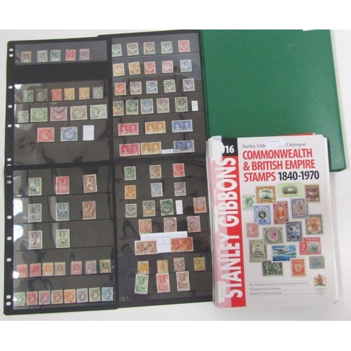 235 - GB, British Empire & Commonwealth: Red album of mostly mint and used definitives & commemoratives, Q... 