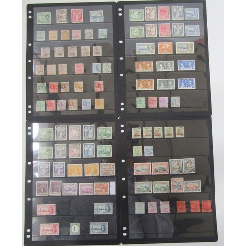 235 - GB, British Empire & Commonwealth: Red album of mostly mint and used definitives & commemoratives, Q... 