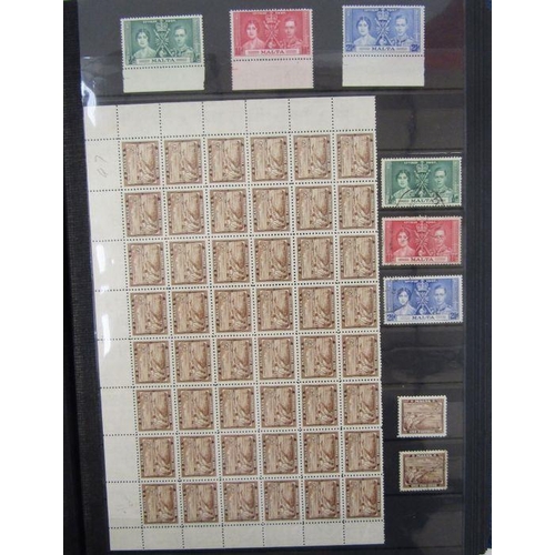 321 - Malta: blue 32-page stock-book of mint & used QV-QEII pre-decimal issues including QV GB cancelled A... 